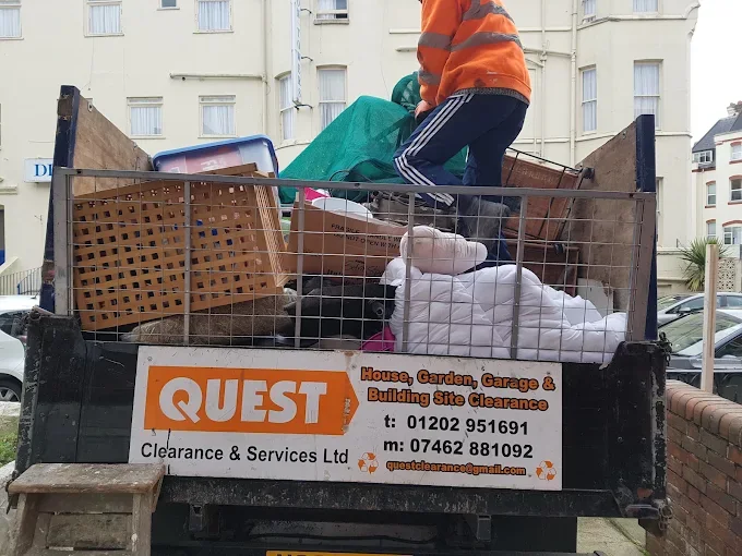 Quest Clearance & Services Ltd truck loaded with cleared household items